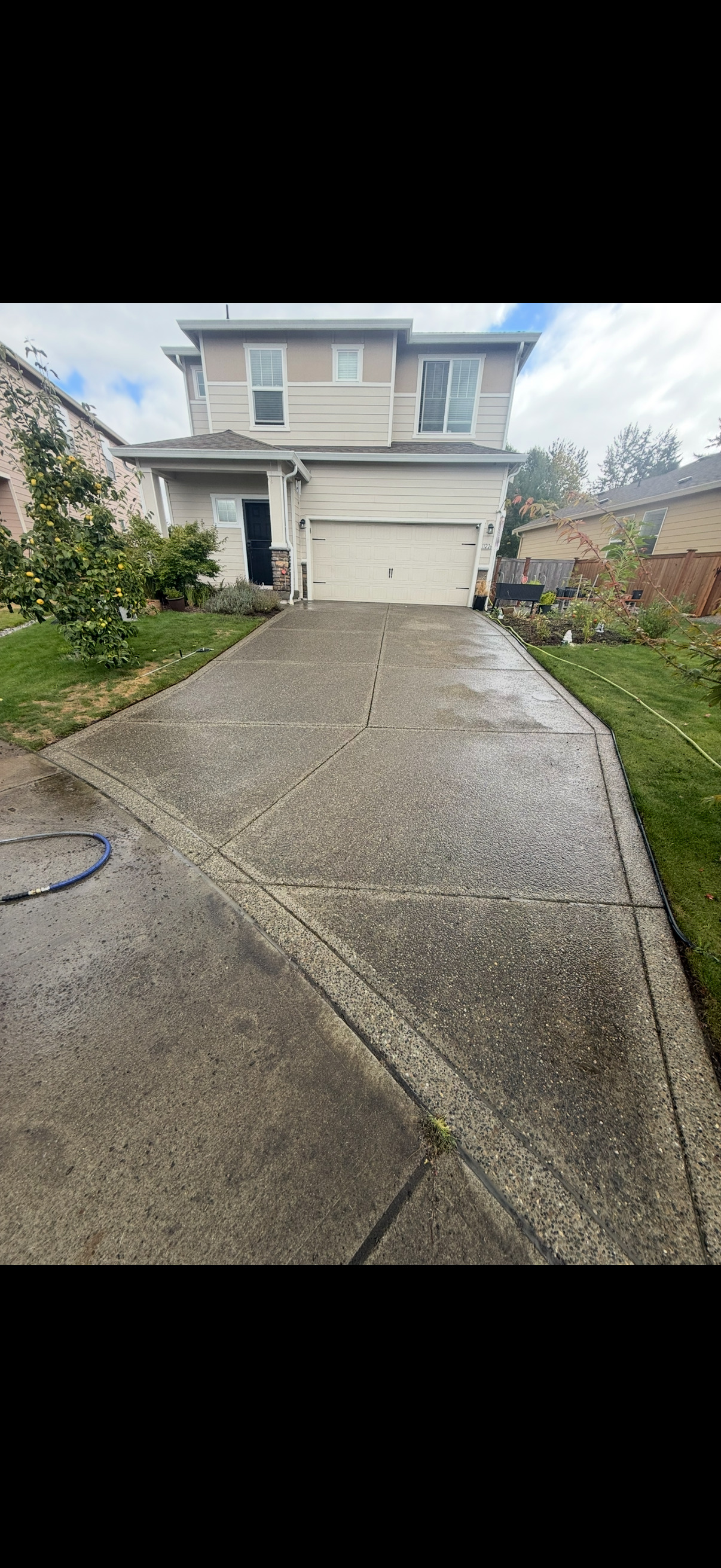 Driveway before pressure washing